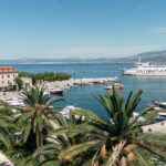 Romantic aerial perspective of Supetar, Brač, where the turquoise waters of the Mediterranean meet charming Dalmatian streets—an ideal setting for weddings and celebrating love.